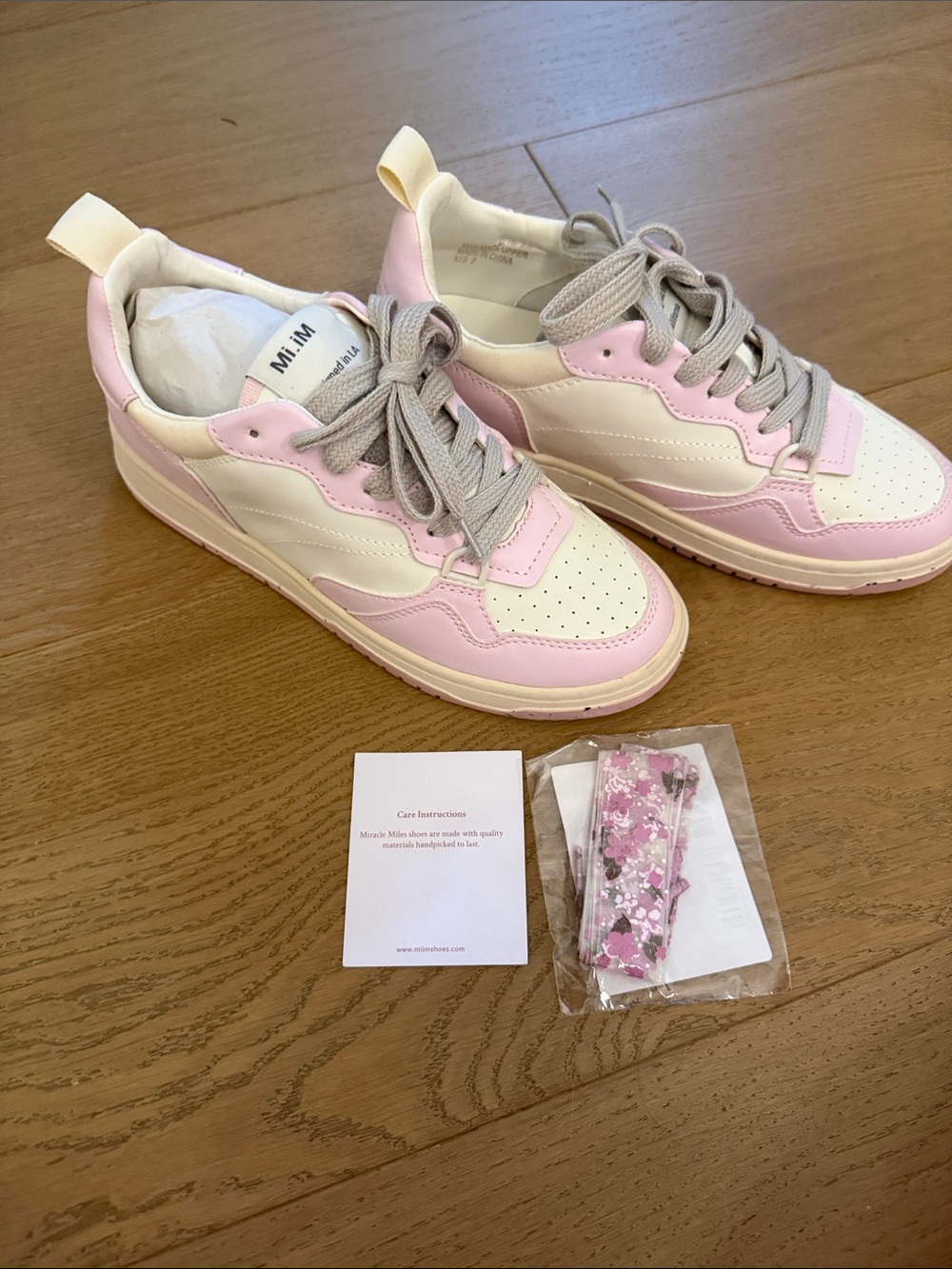 Miracle Miles Pink and Cream Low-Top Sneakers with grey and pink floral laces